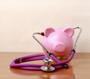 Piggy bank with stethoscope