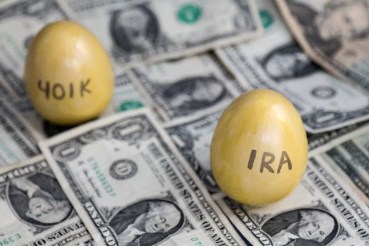 Retirement golden eggs on dollars, IRA in focus, 401k blurry